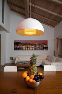 a bowl of fruit on a table in a living room at La Rosa Del Mare in La Maddalena