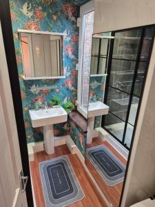 a bathroom with a sink and a mirror at Marketplace Glastonbury in Glastonbury