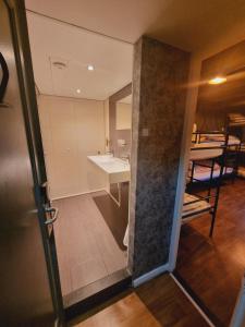 a view of a bathroom with a sink and a mirror at Amsterdam Downtown Hotel Canal View in Amsterdam +124 photos