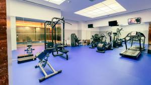 a gym with a bunch of treadmills and machines at VIP Executive Entrecampos Hotel & Conference in Lisbon