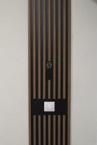 a wooden door with the number on it at LZR - Apartment 57 in Braşov