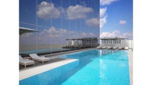 Bazén v ubytování Hotel Local Dubai at Jumeirah Village Triangle nebo v jeho okolí