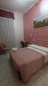 Postel nebo postele na pokoji v ubytování Hotel PRINCIPE AMEDEO