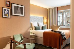 A bed or beds in a room at Hotel D - Basel - Fully Renovated 2025