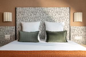 A bed or beds in a room at Hotel D - Basel - Fully Renovated 2025