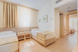 Postel nebo postele na pokoji v ubytování Sural Resort Hotel