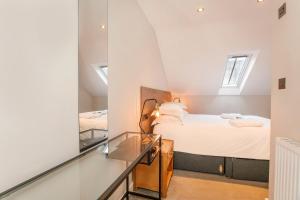 Ένα ή περισσότερα κρεβάτια σε δωμάτιο στο City Apartments - Monkbar Mews