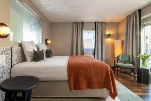 A bed or beds in a room at Hotel D - Basel - Fully Renovated 2025