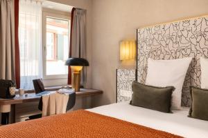 A bed or beds in a room at Hotel D - Basel - Fully Renovated 2025