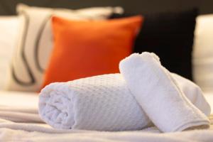 A bed or beds in a room at Elegant, Lugano Lake View, pool and private parking