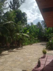 a patio with a bunch of plants and trees at Miroshi Camp Site in Sanya Juu