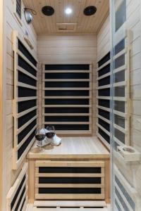 a sauna with two glasses of wine in it at Lavie Maison Sauna and Hot Tub Seaside in Nice