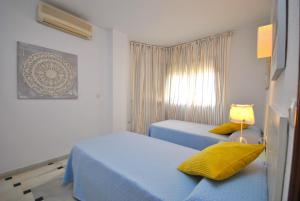 A bed or beds in a room at Cubo's Apartamento B1 2A Lubina del Sol