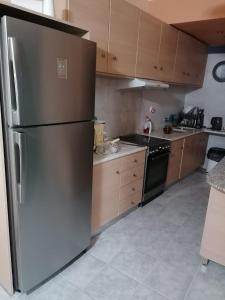 Kuchyň nebo kuchyňský kout v ubytování A Central Apartment