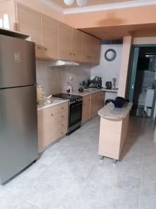 Kuchyň nebo kuchyňský kout v ubytování A Central Apartment