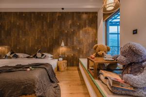 Postel nebo postele na pokoji v ubytování Lijiang Snow Mountain Bengu Hotel-Shuhe Ancient Town Branch 丽江雪山奔鼓酒店-束河古镇店
