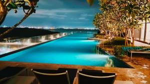 a view of a river from a resort at night at Stunning Luxury Breathtaking Sea & City Views 3BR 12PAX in Jelutong +43 photos
