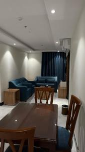 a living room with a couch and a table at HYATT RESiDENCE in Jeddah