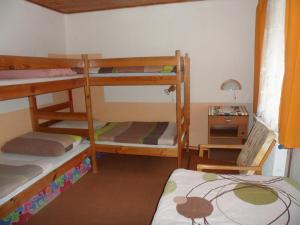 Tempat tidur dalam kamar di Pension Mikulka