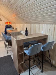 a kitchen with a large wooden table and chairs at Mountain Mia in Šišava