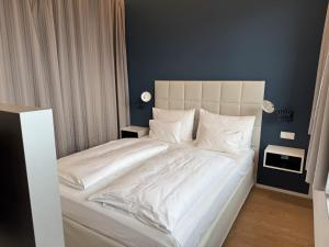Posteľ alebo postele v izbe v ubytovaní Skyline City Loft