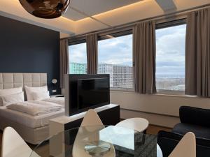 Televízia a/alebo spoločenská miestnosť v ubytovaní Skyline City Loft