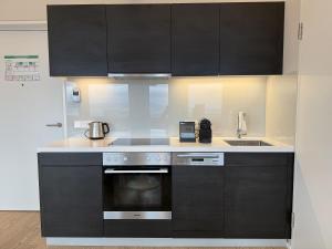 Kuchyňa alebo kuchynka v ubytovaní Skyline City Loft