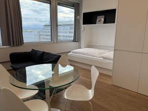 Posteľ alebo postele v izbe v ubytovaní Skyline City Loft