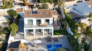 an aerial view of a house with a swimming pool at The Villa by Los Limoneros in Teulada