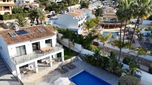 an aerial view of a building with a swimming pool at The Villa by Los Limoneros in Teulada +110 photos