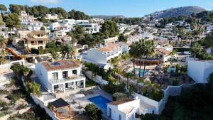 an aerial view of a town with white houses at The Villa by Los Limoneros in Teulada