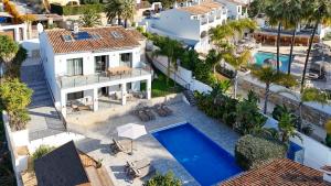 an aerial view of a villa with a swimming pool at The Villa by Los Limoneros in Teulada