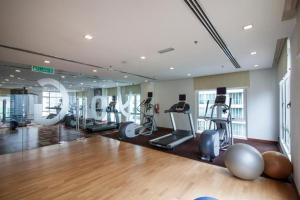 a gym with several treadmills and exercise machines at COZY SUPER KING BED STUDIO walking to PETRONAS KLCC by Zen Glo in Kuala Lumpur
