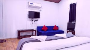 Uma cama ou camas num quarto em Samant Beach Resort