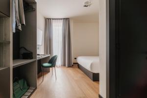 Voodi või voodid majutusasutuse Aspio Hotel toas