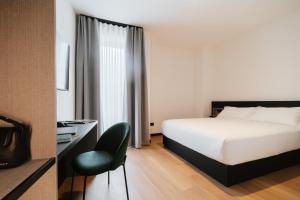 Voodi või voodid majutusasutuse Aspio Hotel toas
