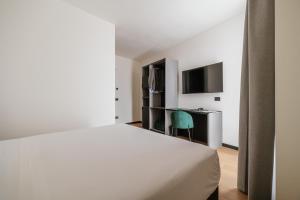 Voodi või voodid majutusasutuse Aspio Hotel toas