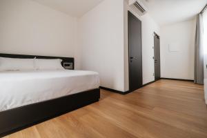 Voodi või voodid majutusasutuse Aspio Hotel toas