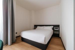 Voodi või voodid majutusasutuse Aspio Hotel toas