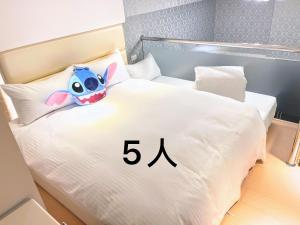 Llit o llits en una habitació de 冰與火之閣