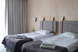 Postel nebo postele na pokoji v ubytování Baltic Hotel