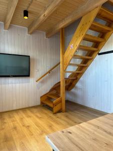 Et tv og/eller underholdning på Domki Wakacyjne Rybak