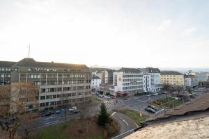 a view of a city with buildings and a street at Wohnung im Zentrum von Koblenz in Koblenz