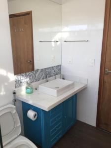 a bathroom with a sink and a toilet at Mirante do Morro in Alto Paraíso de Goiás +51 photos