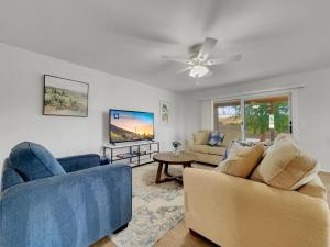 a living room with two couches and a tv at Truro Sun Lakes in Sun Lakes +31 photos