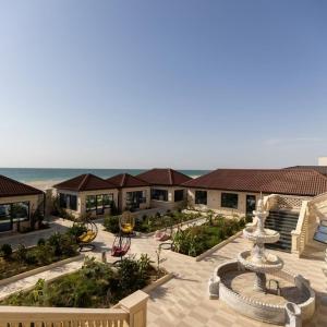 an aerial view of a resort with a fountain at Shahristan Hotel in Aktau