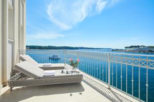 a balcony with a view of the water at BO Hotel Palazzo in Poreč