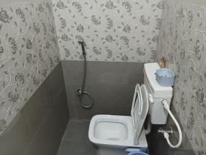 Koupelna v ubytování Ramaya Homestay + 6 fotografií