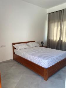 Postel nebo postele na pokoji v ubytování Laranjinha Rooms