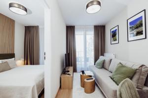Giường trong phòng chung tại Stay4U Apartments Mariental Residence